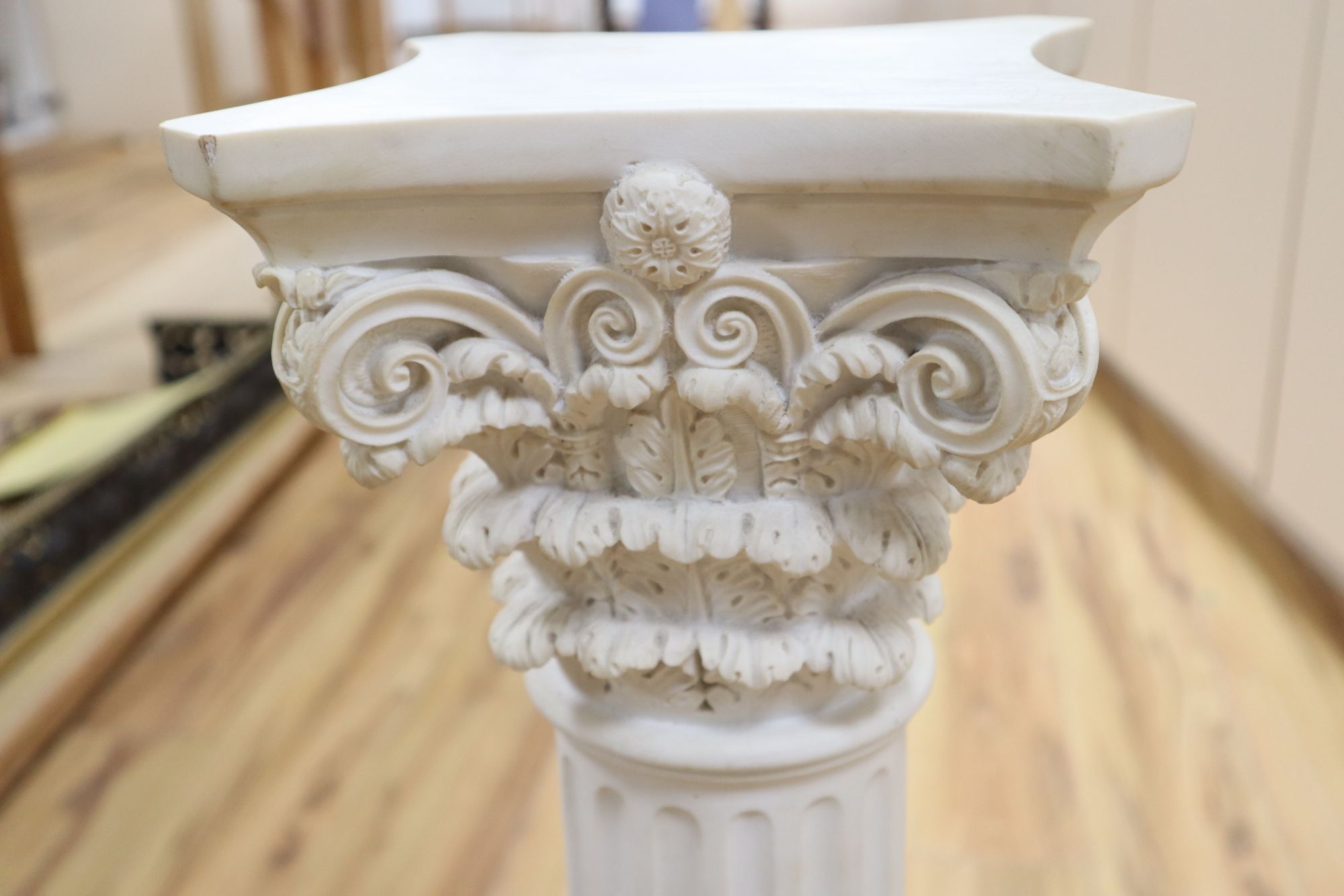 A composition Corinthian column pedestal, signed Guelli, height 72cm